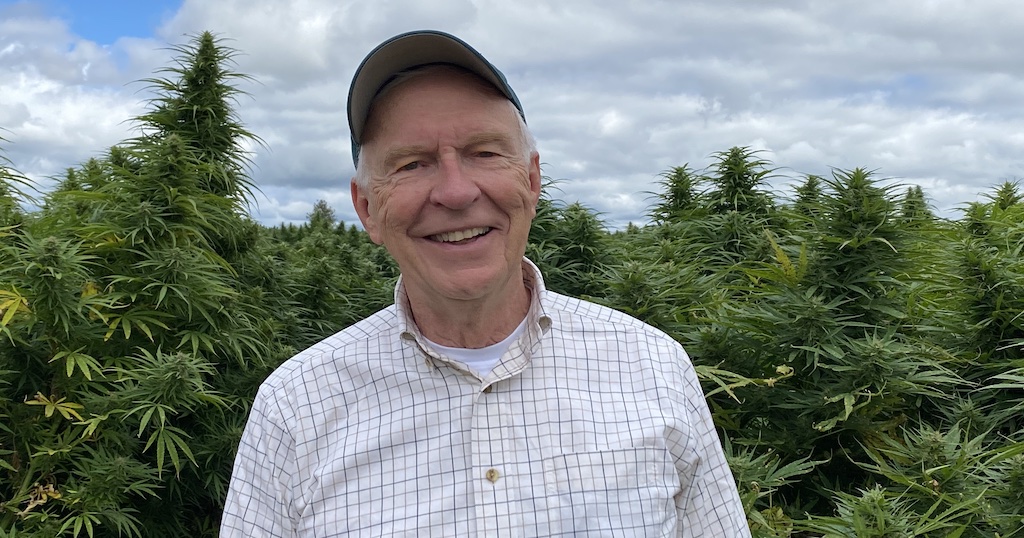 Dr. Jim Kane, Chief Science Officer at OP Innovates, poses in front of a hemp field. Kane will help lead the bioavailability study of Naturia Plus.